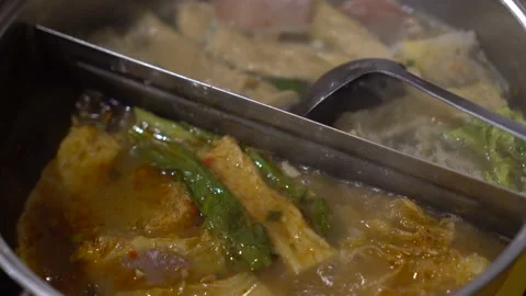 Two kind of boiled soup or "sabu-sabu" Japanese vegetable soup Stock Footage 211791603