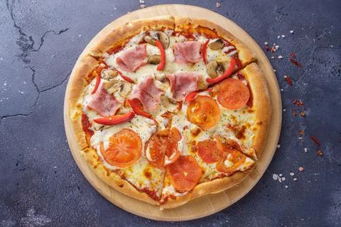 Two kind of pizza together on the same board Stock Photos