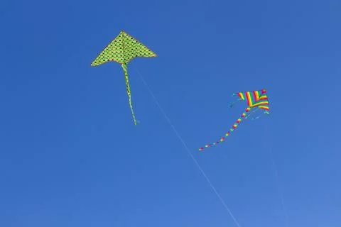 Two kites in a clear sky Stock Photos
