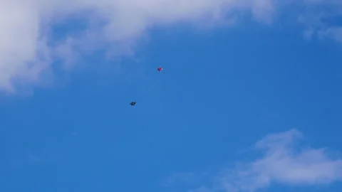 Two kites fighting aggressively with each other, swinging and fast movements Stock Footage 258655109