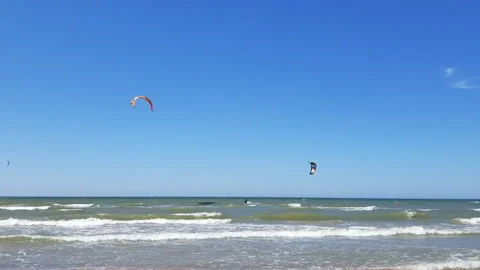Two kitesurf athlete rides the waves of the Baltic Sea. Stock Footage 140900843
