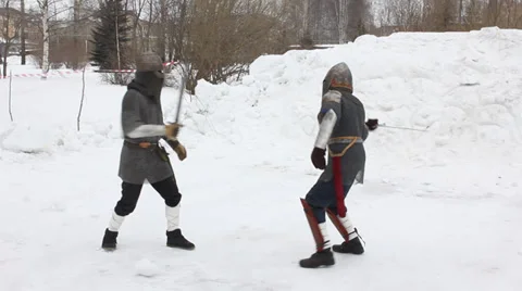 Two knights in armor fighting with swords Stock Footage 35739316