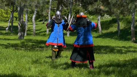 Two knights carry out attacks and do not block each other's blows Stock Footage 122079686
