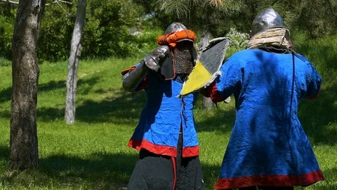 Two knights in a duel, reflect the blows of each other's swords with the help of Stock Footage 122079714