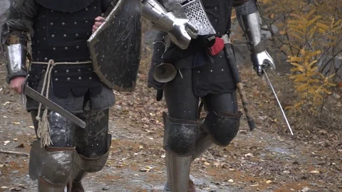 Two knights go ahead with a helmet in their hands Stock Footage 81671718