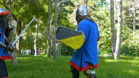 Two knights practice sword attacks and learn mistakes Stock Footage 122079976