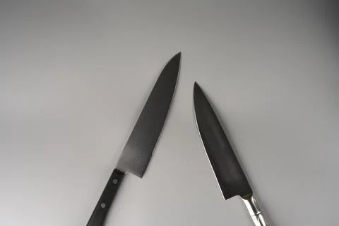 Two knives are pointed at each other. Foto stock