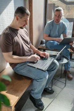 Two knowledgeable professionals collaborating effectively together in a modern Stock Photos