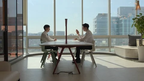 Two Korean Businessmen Talking at Bright Modern Office Table 스톡 동영상 338045767