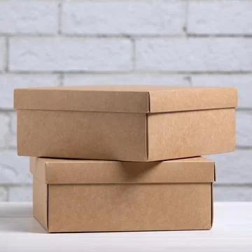 Two kraft cardboard boxes on the table Stock Photos