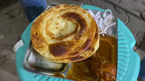 Two Laccha Paratha made from refined wheat flour and chopped onion are 스톡 동영상 208670983
