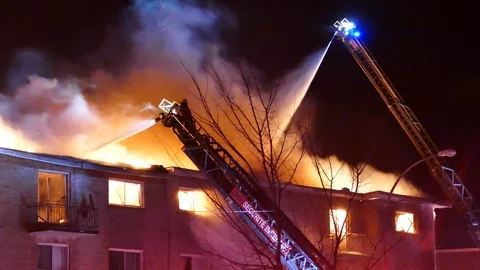 Two ladders fighting fire Stock Footage 105299068