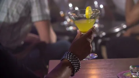 Two ladies are clinking their glasses with cocktails Stock Footage 112196737
