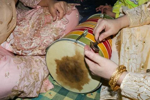 Two ladies beating Double headed indian drum on wedding Stock Photos