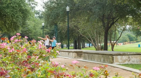 Two Ladies Exploring Hermann Park in Houston TX Stock Footage 43384527