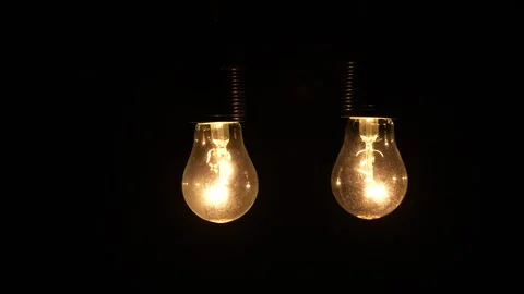 Two lamp flickering on a black background, Close-up Stock Footage 263717724