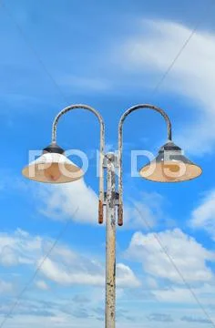 Two lampposts on sky Stock Photos