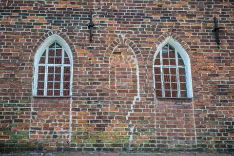 Two lancet windows on ancient brick wall Stock Photos
