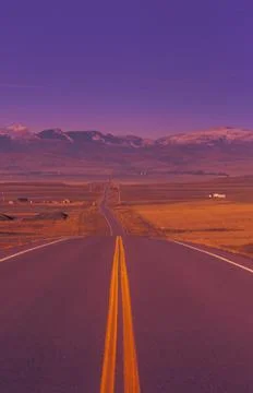 Two Lane Highway Going Down Into Valley Stock Photos