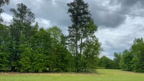 Two lane road trees divide the lanes on Windsor Spring road Stock Footage 152433077
