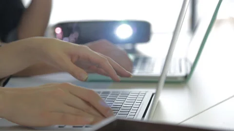 Two laptop computer and colleagues discussing data about business financial Stock Footage 58033758