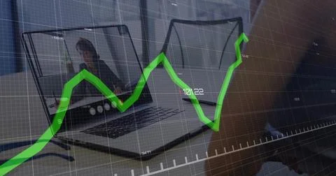 Two laptops showing call interface and hand typing in home office, with blue Stock Photos
