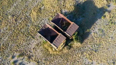 Two large abandoned mining trucks. Aerial view. Stock Photos