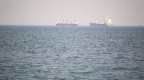 Two large barges are at anchor and waiting their turn to go through customs Video stock 59998213