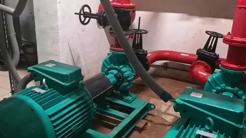 Two large electric pumps on the heating pipe in the boiler room. Stock Footage 220565559