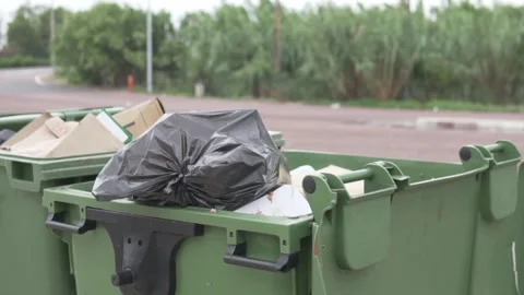 Two large garbage cans stand on the highway in Spain in the summer Stock Footage 249728074