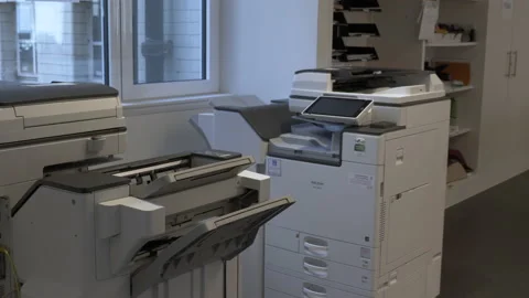 Two Large Multifunctional Printers In Empty Office. Pan Right Stock Footage 152935355