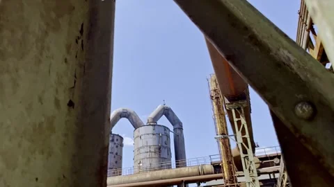 two large old tanks between steel struts... | Stock Video | Pond5