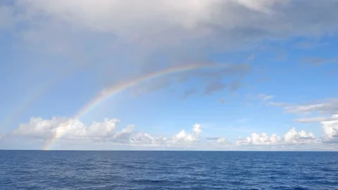 Two large rainbows in the open ocean in the Seychelles. Stock Footage 155797341