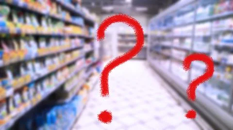 Two large red question marks on abstract blur image of supermarket background Foto stock