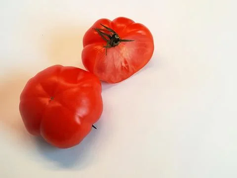 Two large ripe red tomatoes on a white background, Stock Photos