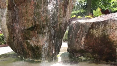 Two large rocks rock structure waterfall fountain with water coming down Stock-Footage 249422415
