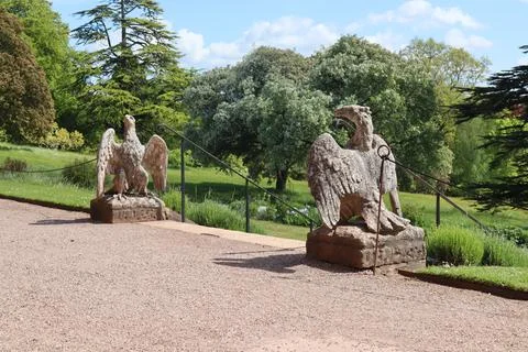Two large stone eagles at the top of a long flight of steps in the grounds of Stock Photos