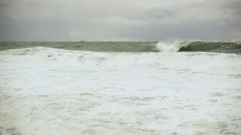 Two large storm waves roll ashore slow motion Stock Footage 82024877
