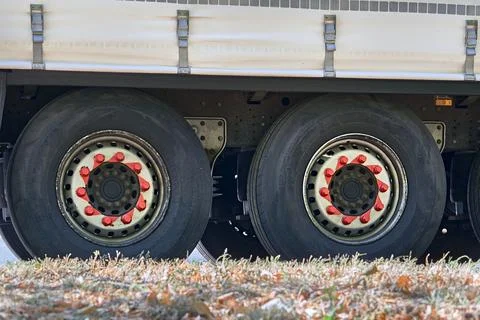 Two large wheels of a heavy duty long haul trailer 写真素材