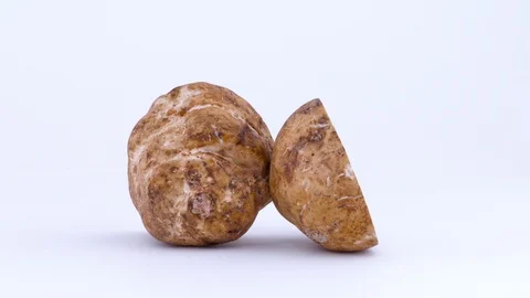 Two large white truffle mushroom halves rotating on the turntable isolated Vídeo Stock 93560659
