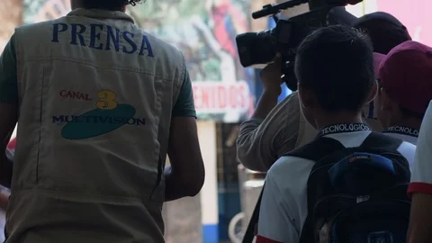 Two latin camera men working as press/news reporters in Guatemala Stock Footage 114918539