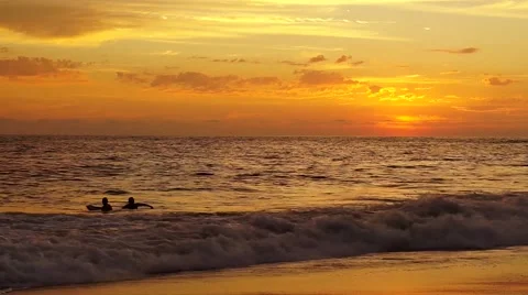 Two latin men in the ocean playing with waves  with their boogie board Stock Footage 46080884