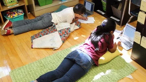 Two Latinos doing work on computer Stock Footage 85705471