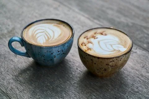 Two latte coffees on the table Stock Photos