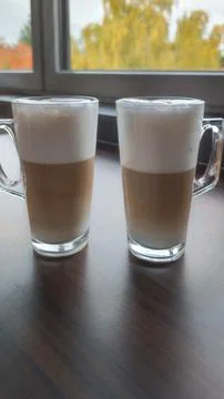 Two Latte Glasses on Table. Stock Photos