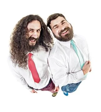 Two laughing ners posing in office Stock Photos