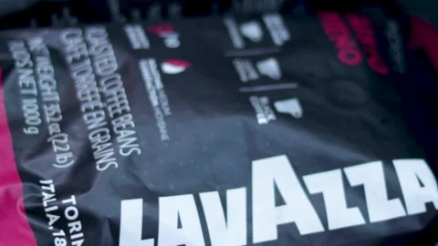 Two lavazza beans pack in a car trunk Stock Footage 166582045
