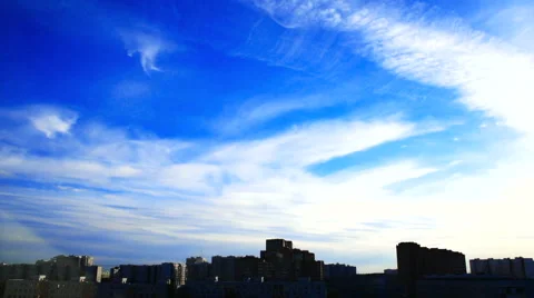 Two layers of clouds over the city Stock Footage 54521584