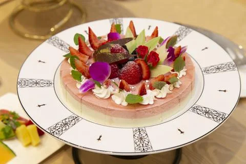 Two layers of pudding with melon and strawberries Stock Photos