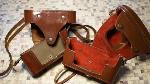 Two leather cases for cameras, of different qualities Stock Footage 122625559